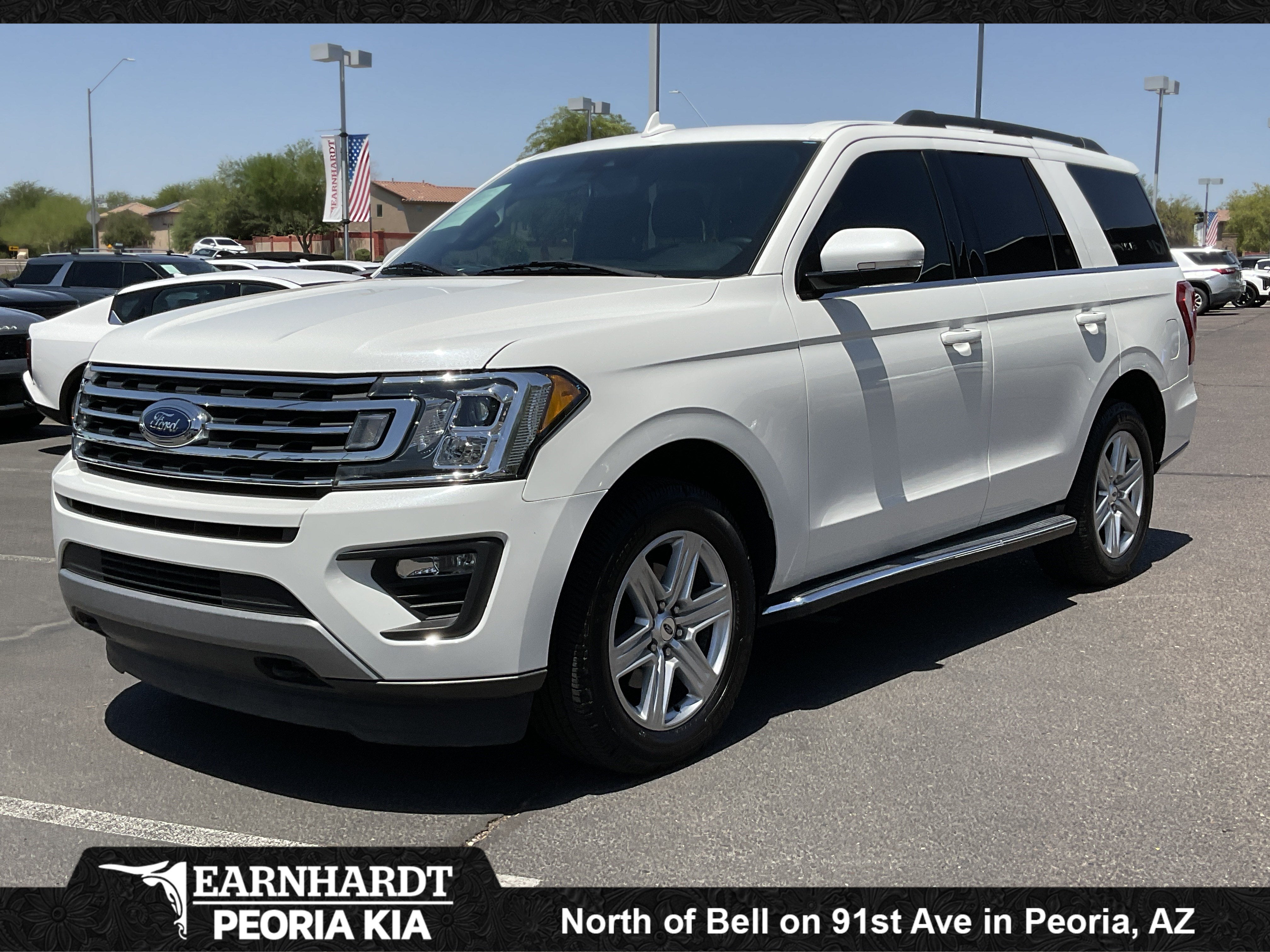 2021 Ford Expedition XLT in Star White Metallic Tri-Coat — front three-quarter view