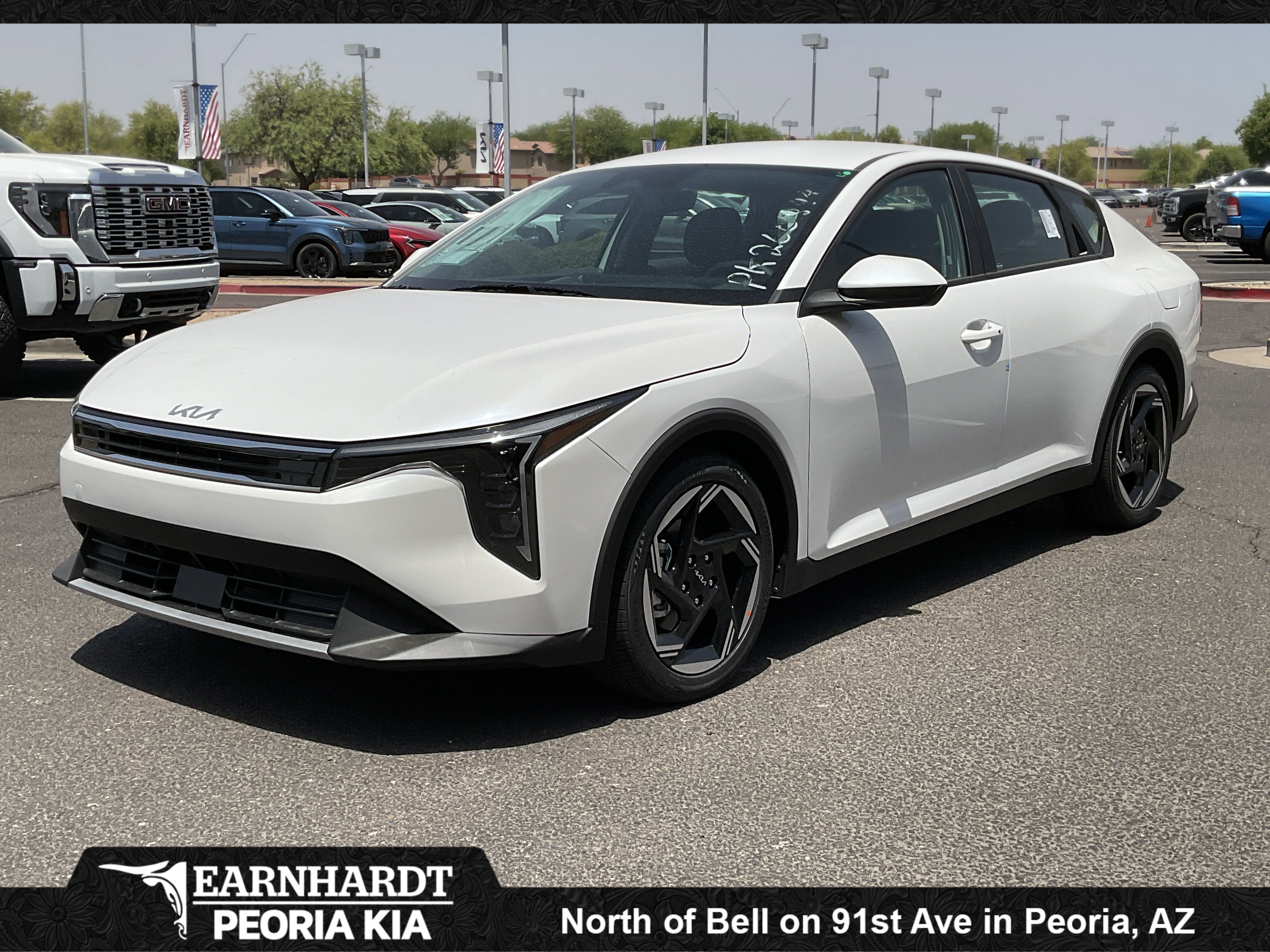 2026 Kia K4 EX in Snow White Pearl — front three-quarter view