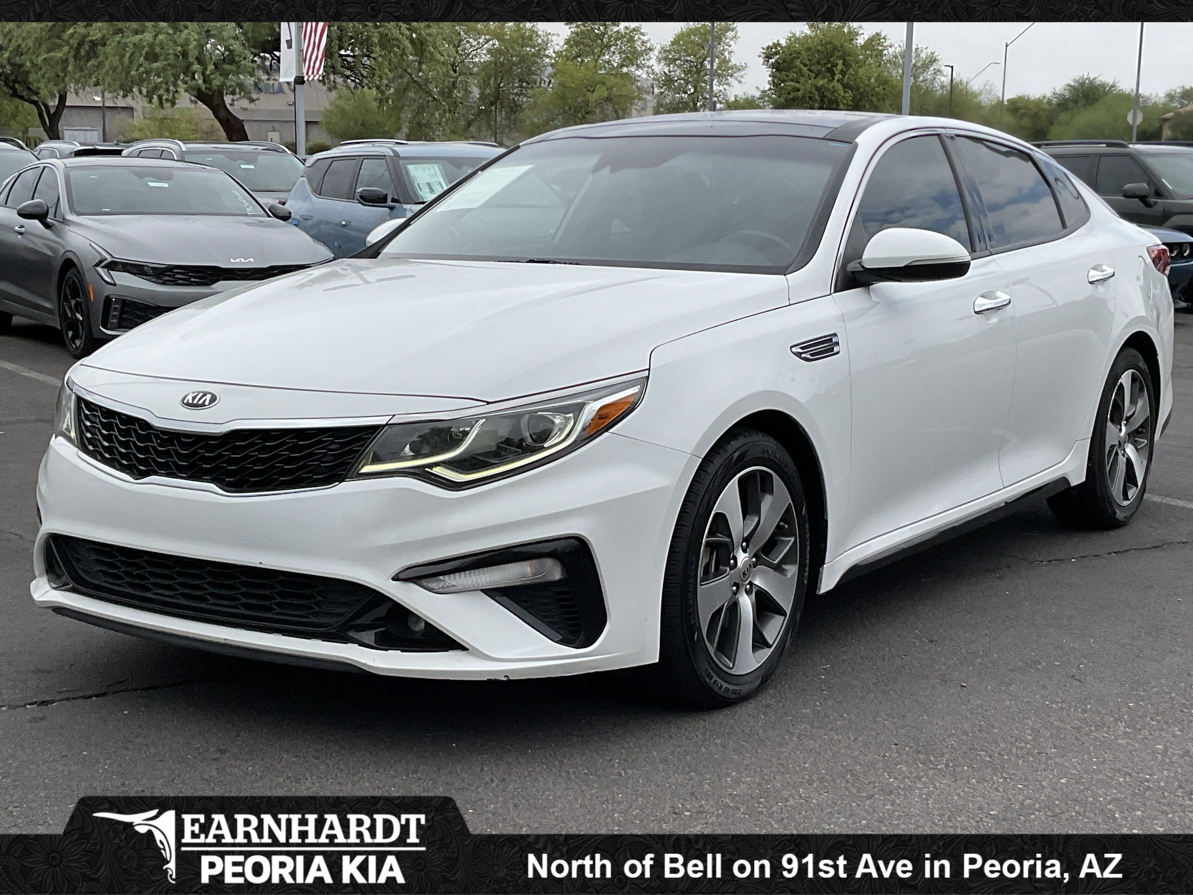 2019 Kia Optima S in Snow White Pearl — front three-quarter view