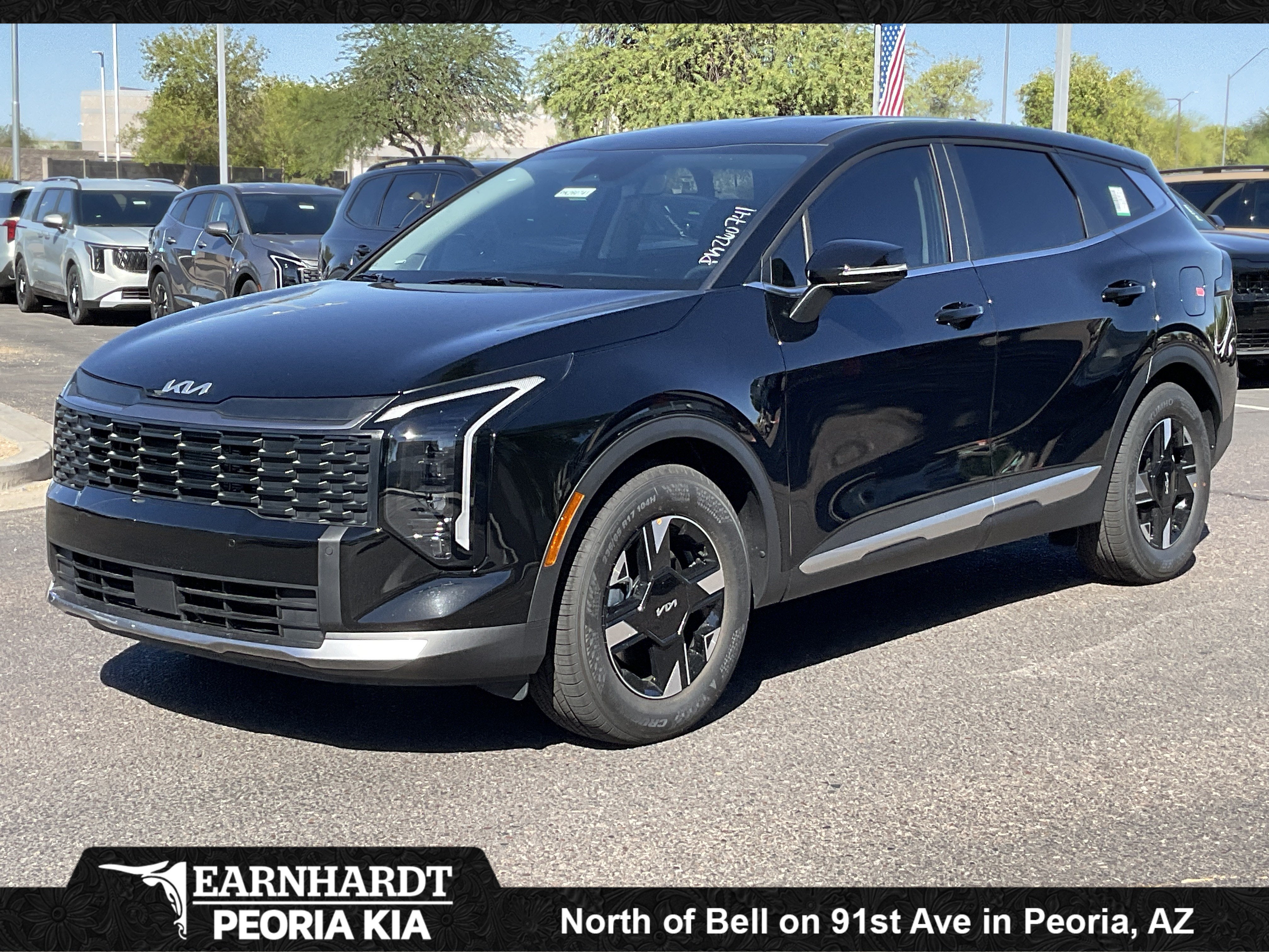 2026 Kia Sportage LX in Ebony Black — front three-quarter view
