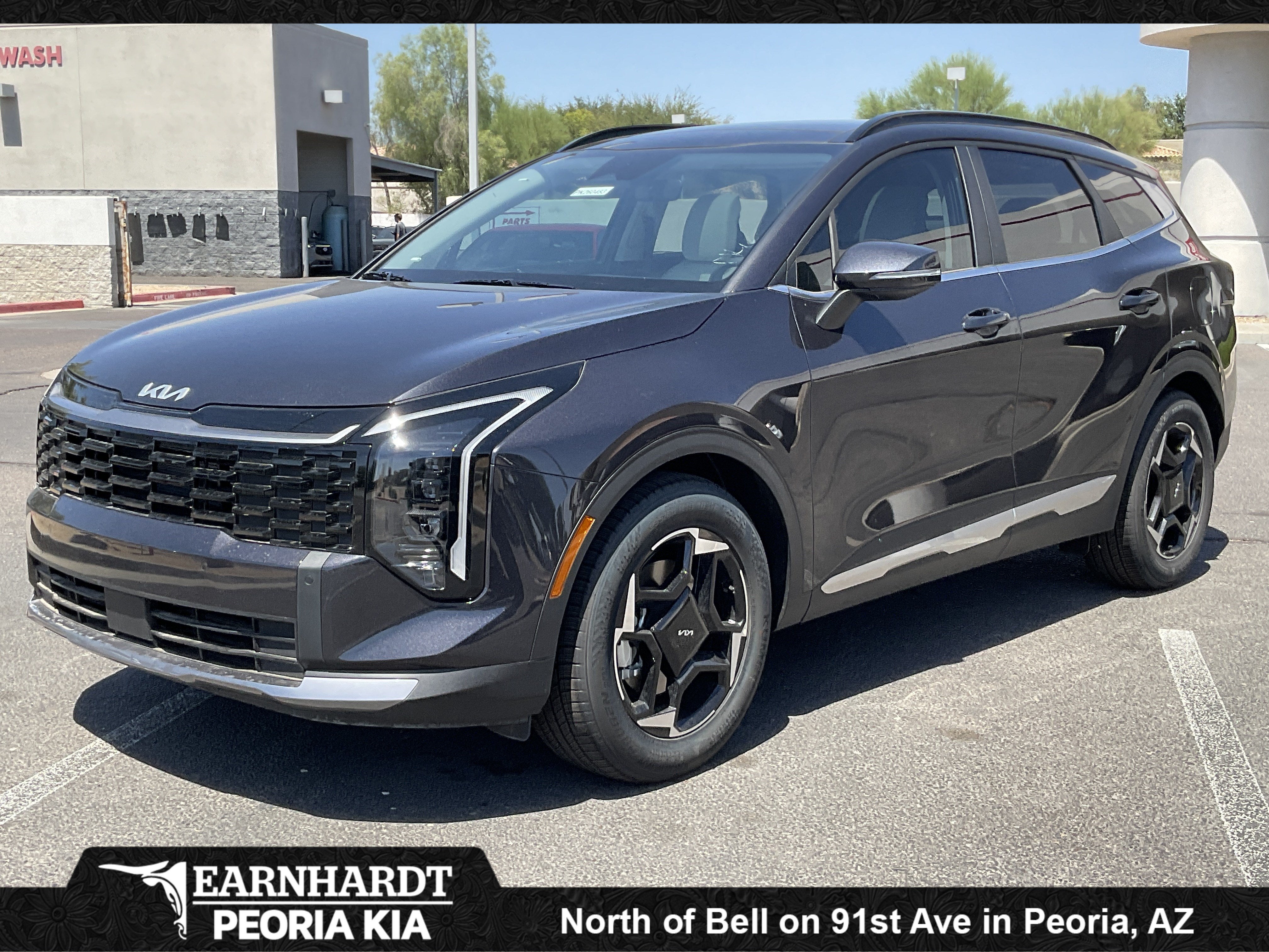 2026 Kia Sportage EX in Panthera Metal Gray — front three-quarter view
