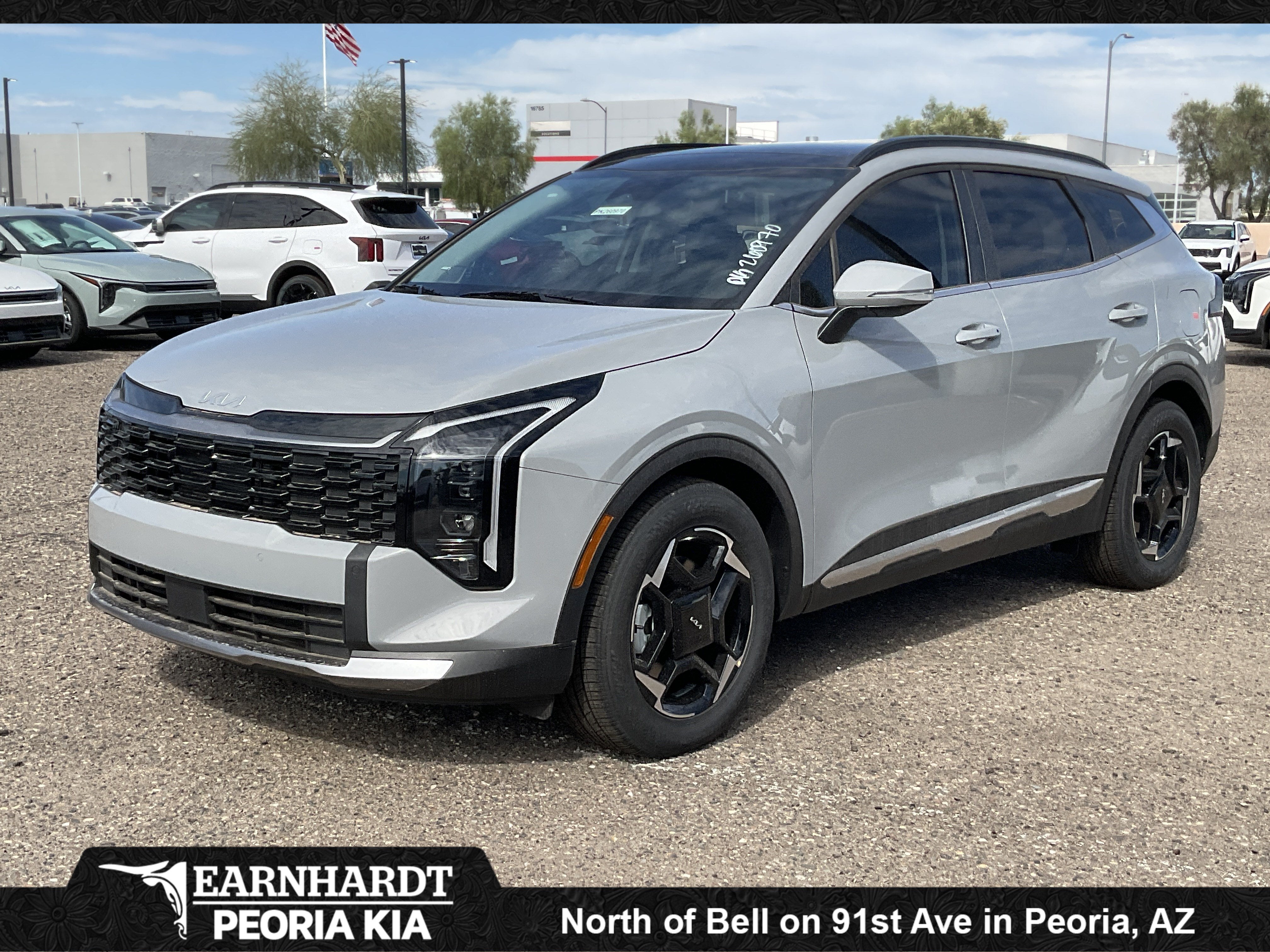 2026 Kia Sportage EX in Wolf Gray — front three-quarter view