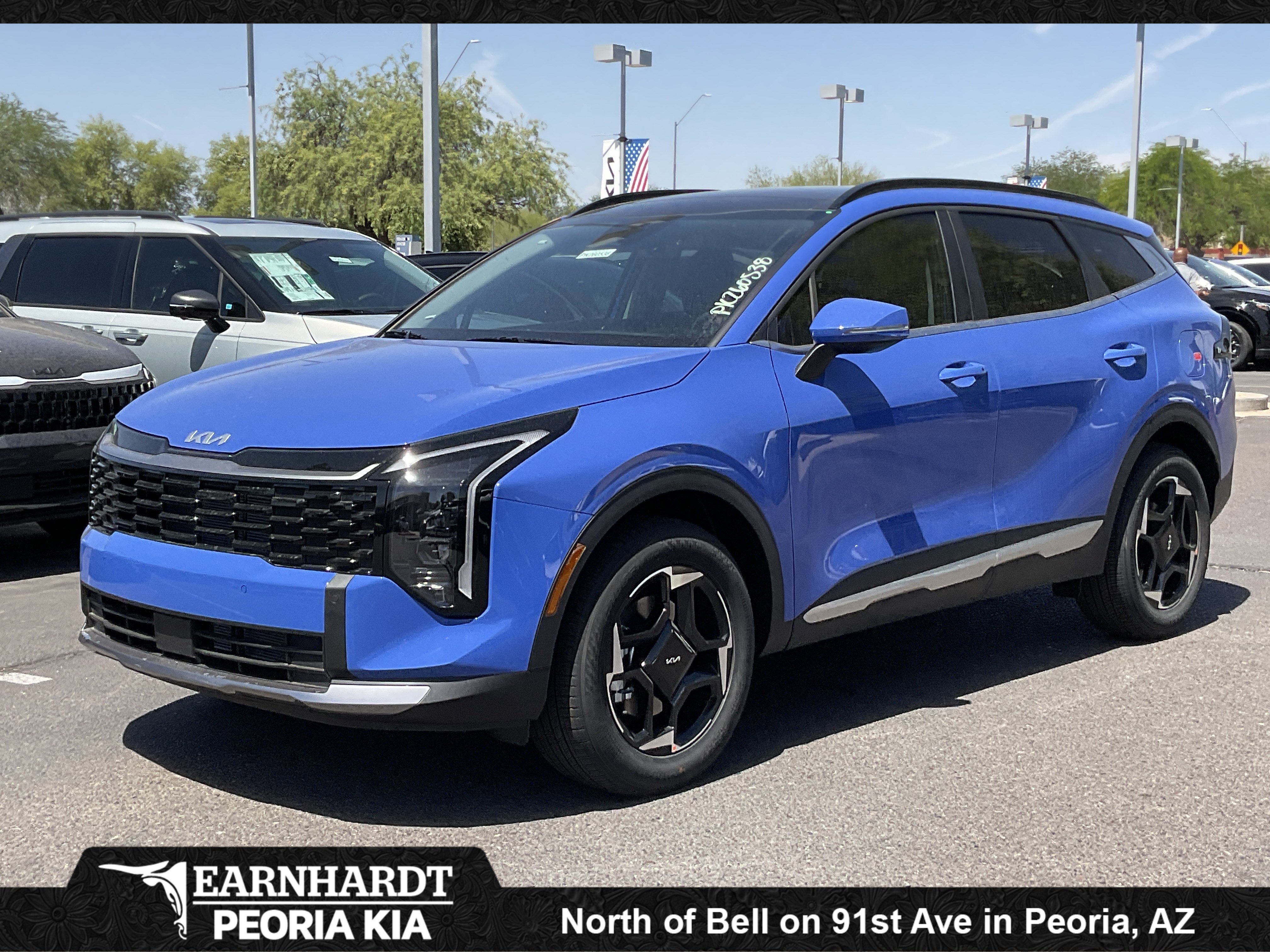 2026 Kia Sportage EX in Nebular Blue — front three-quarter view