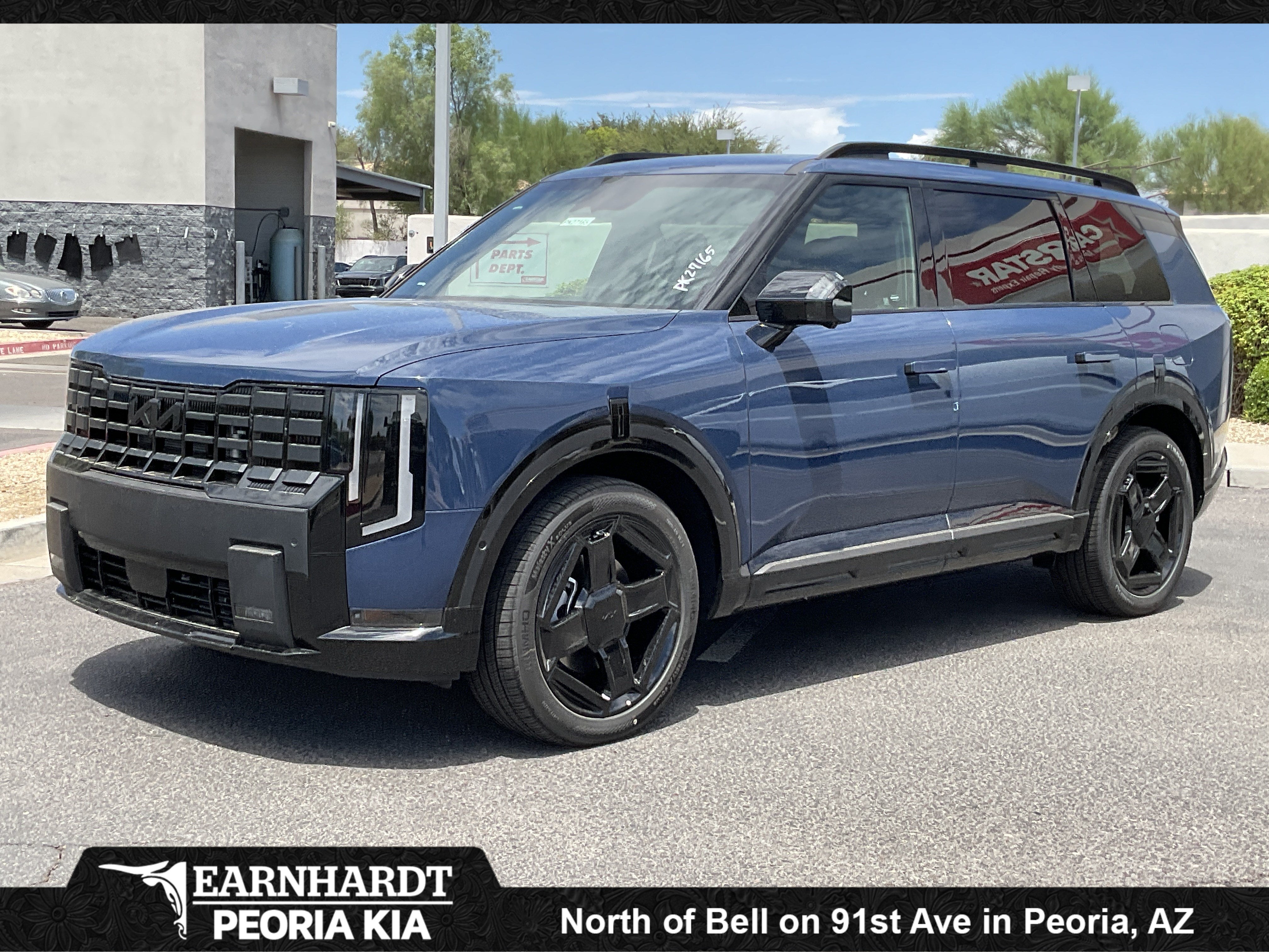 2027 Kia Telluride Hybrid X-Line SX-Prestige in Midnight Lake Blue — front three-quarter view