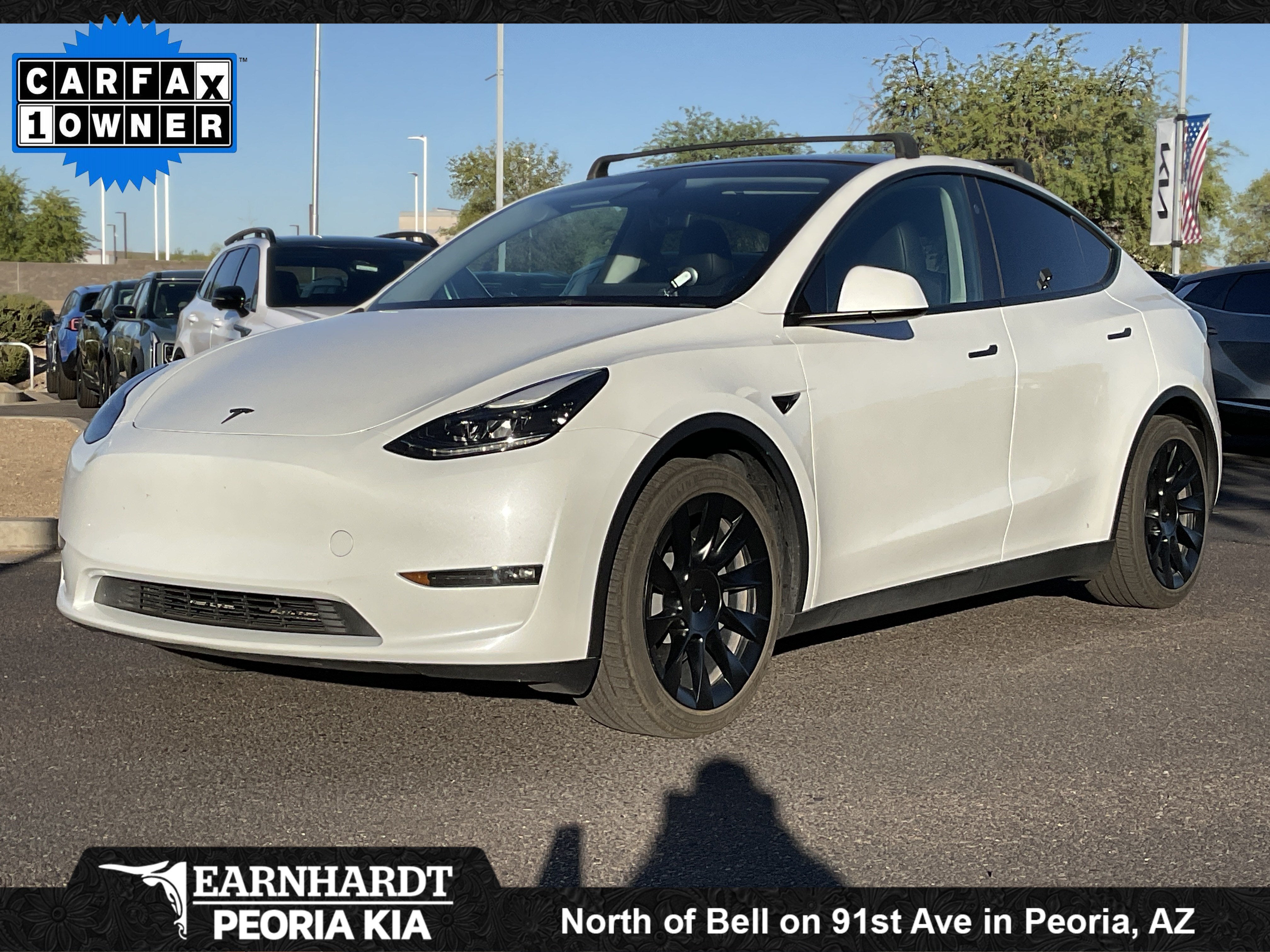 2023 Tesla Model Y Long Range in Pearl White Multi-Coat — front three-quarter view