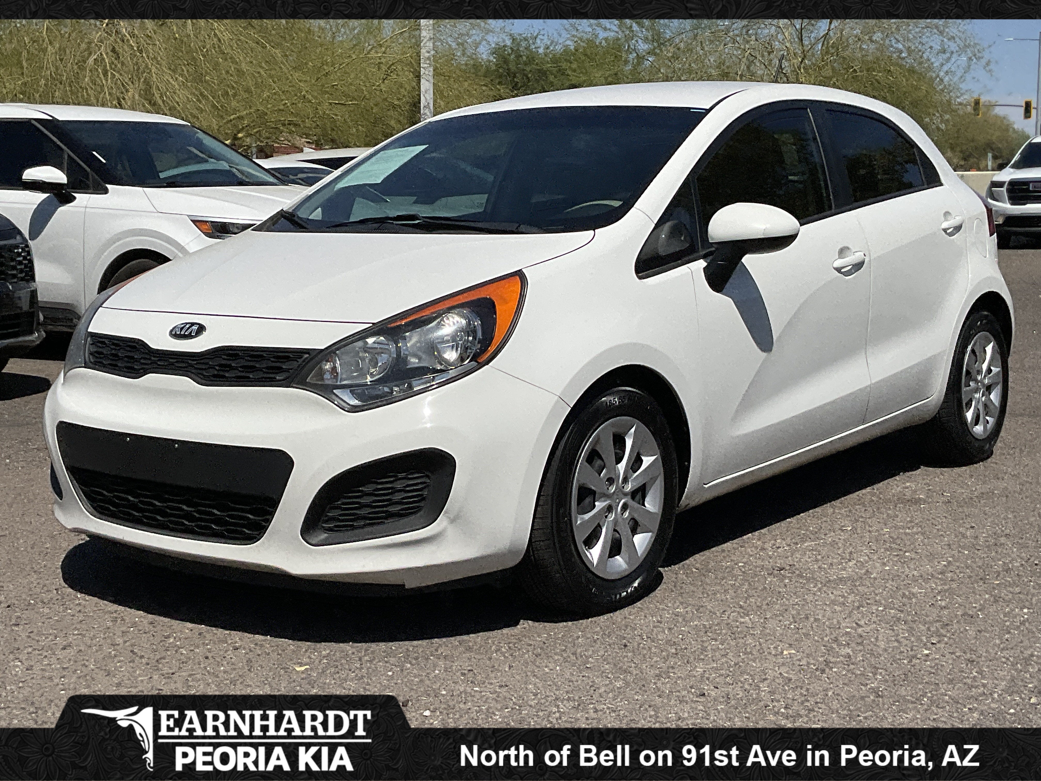 2013 Kia Rio LX in Clear White — front three-quarter view