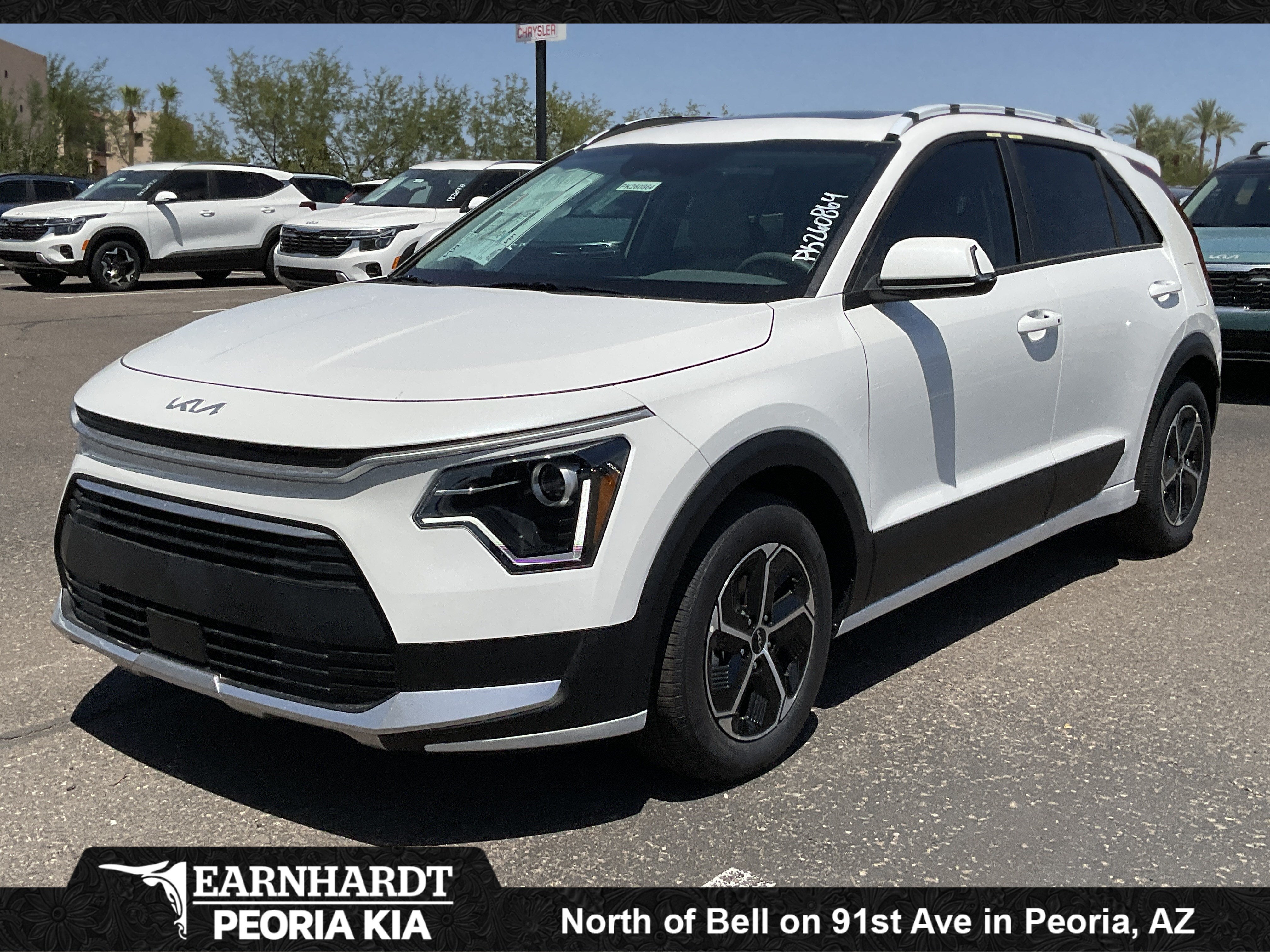 2026 Kia Niro EX in Snow White Pearl — front three-quarter view
