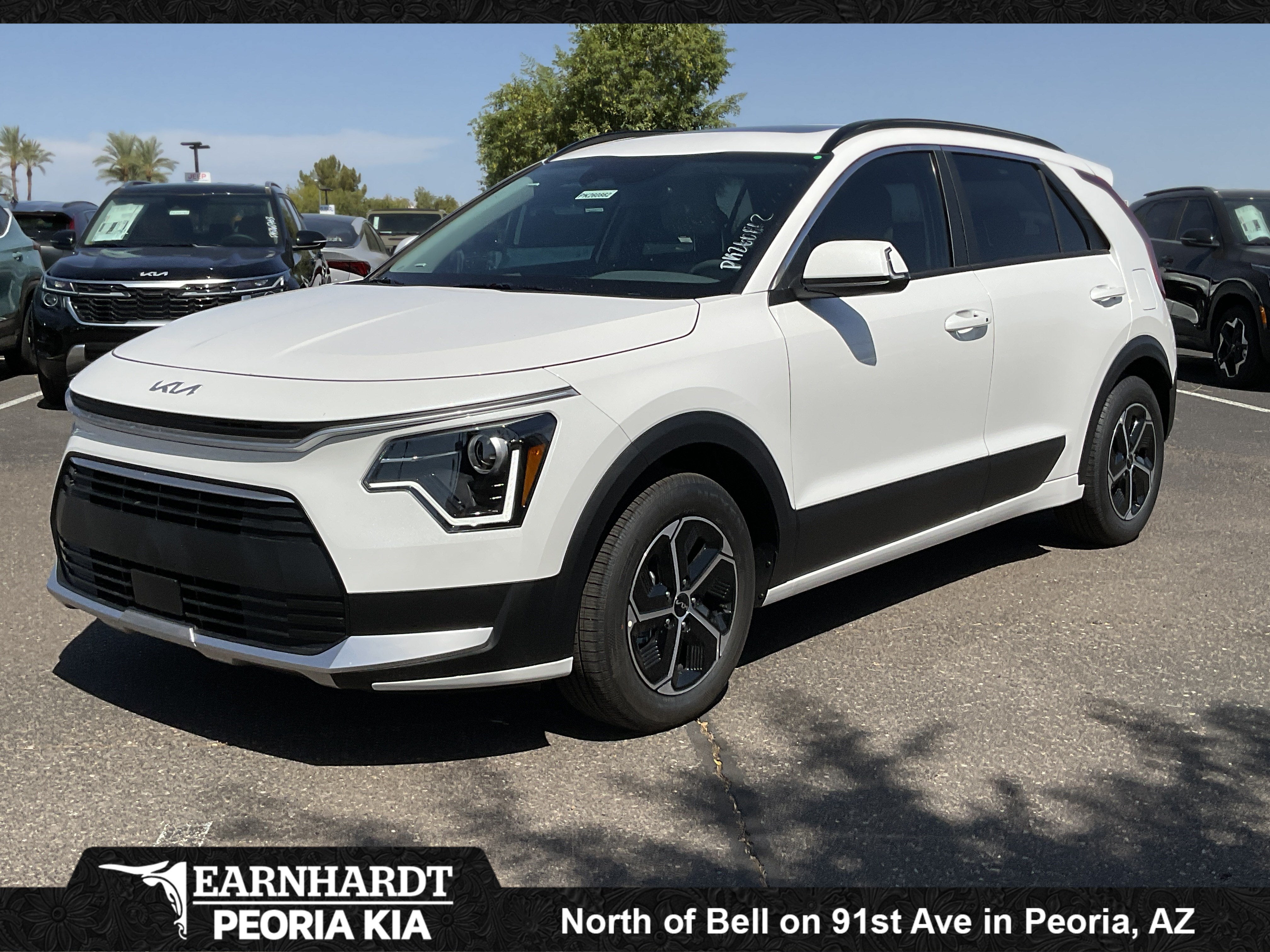 2026 Kia Niro EX in Snow White Pearl — front three-quarter view