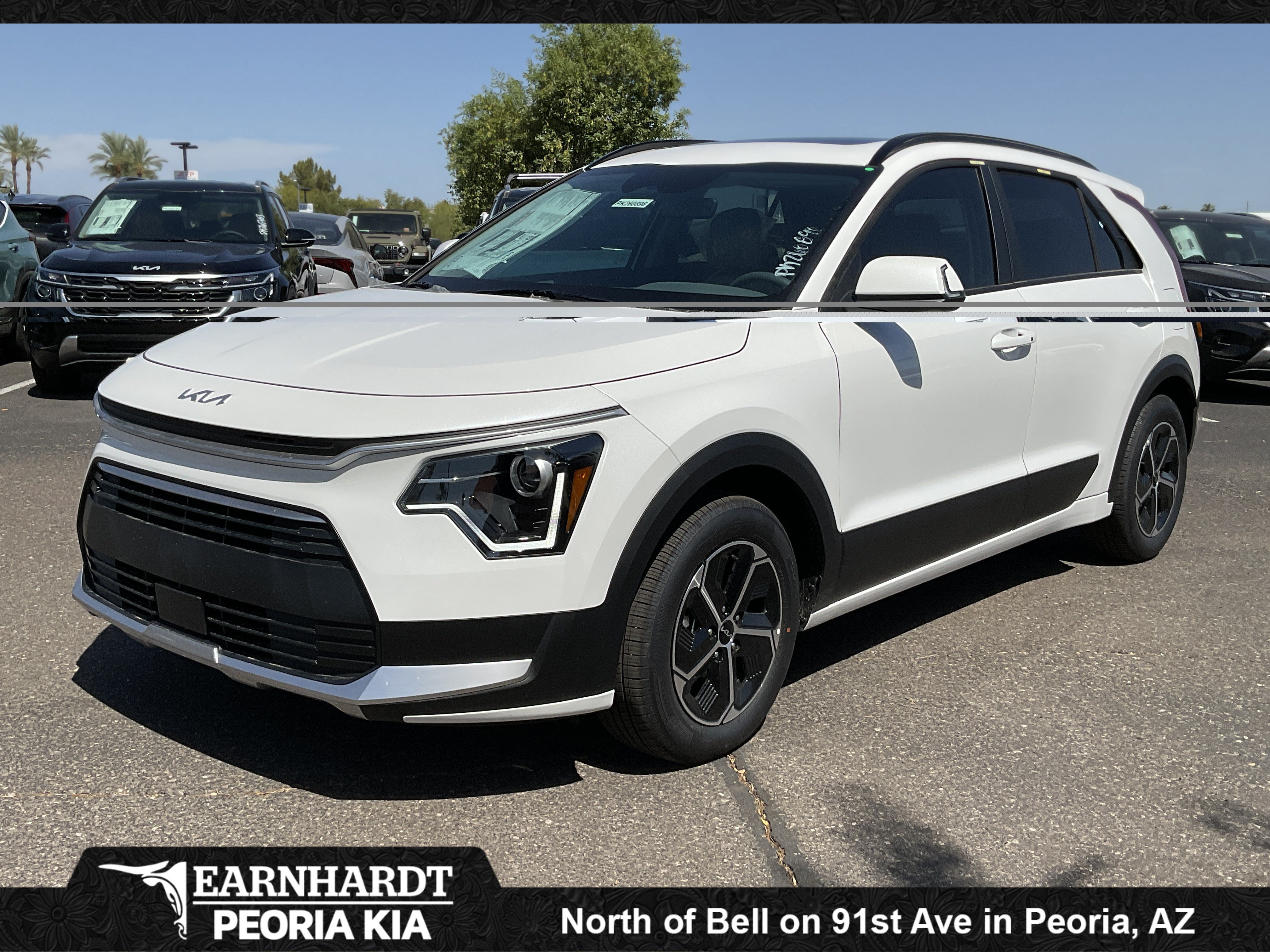 2026 Kia Niro EX in Snow White Pearl — front three-quarter view