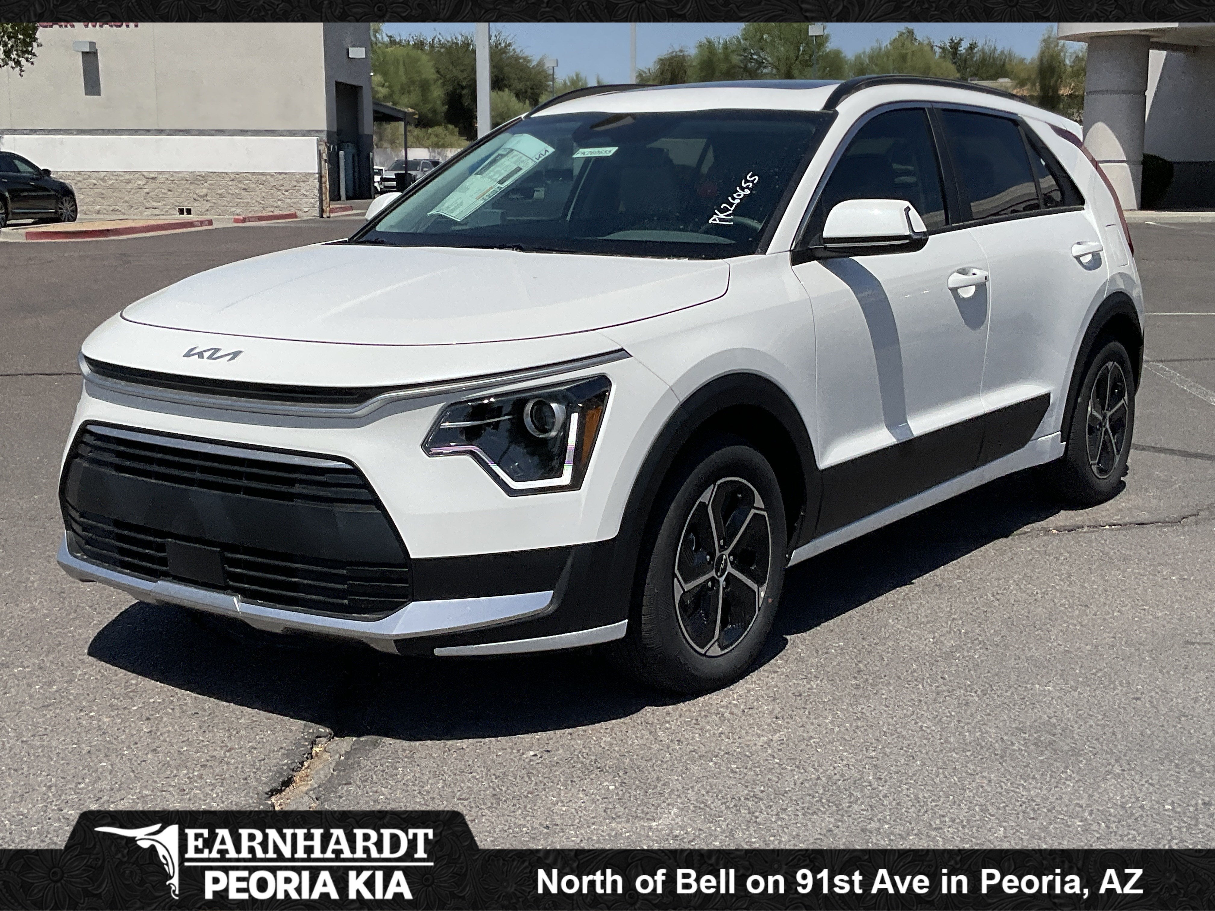 2026 Kia Niro EX in Snow White Pearl — front three-quarter view