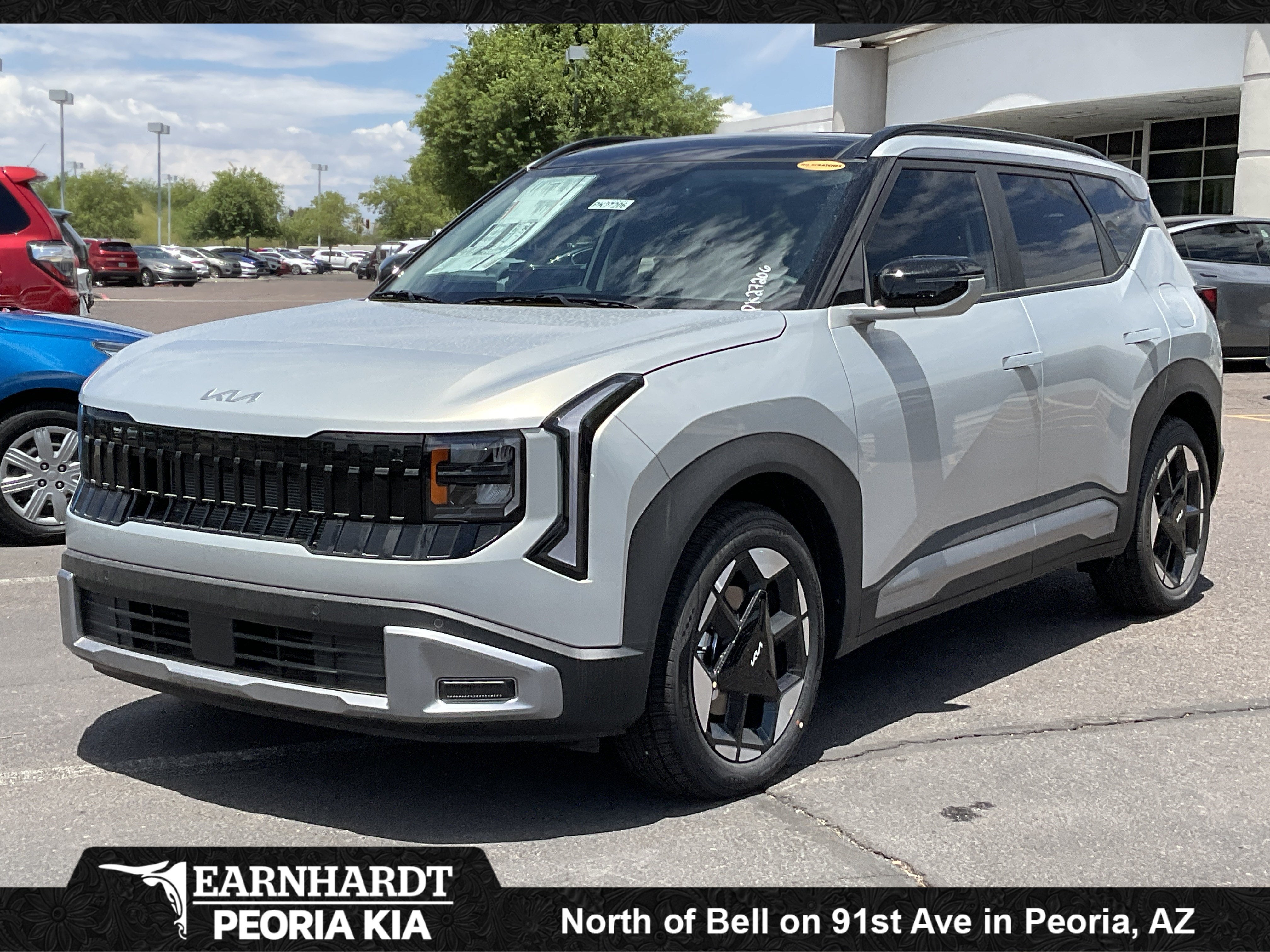 2027 Kia Seltos EX in Ivory Silver — front three-quarter view