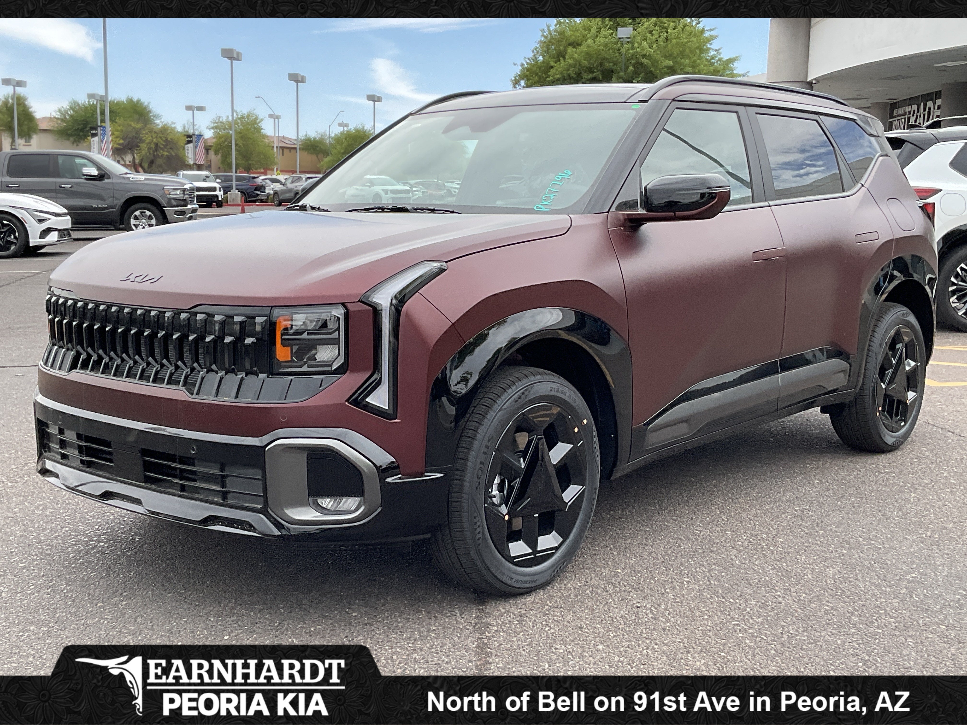 2027 Kia Seltos X-Line S in Magma Red Matte — front three-quarter view