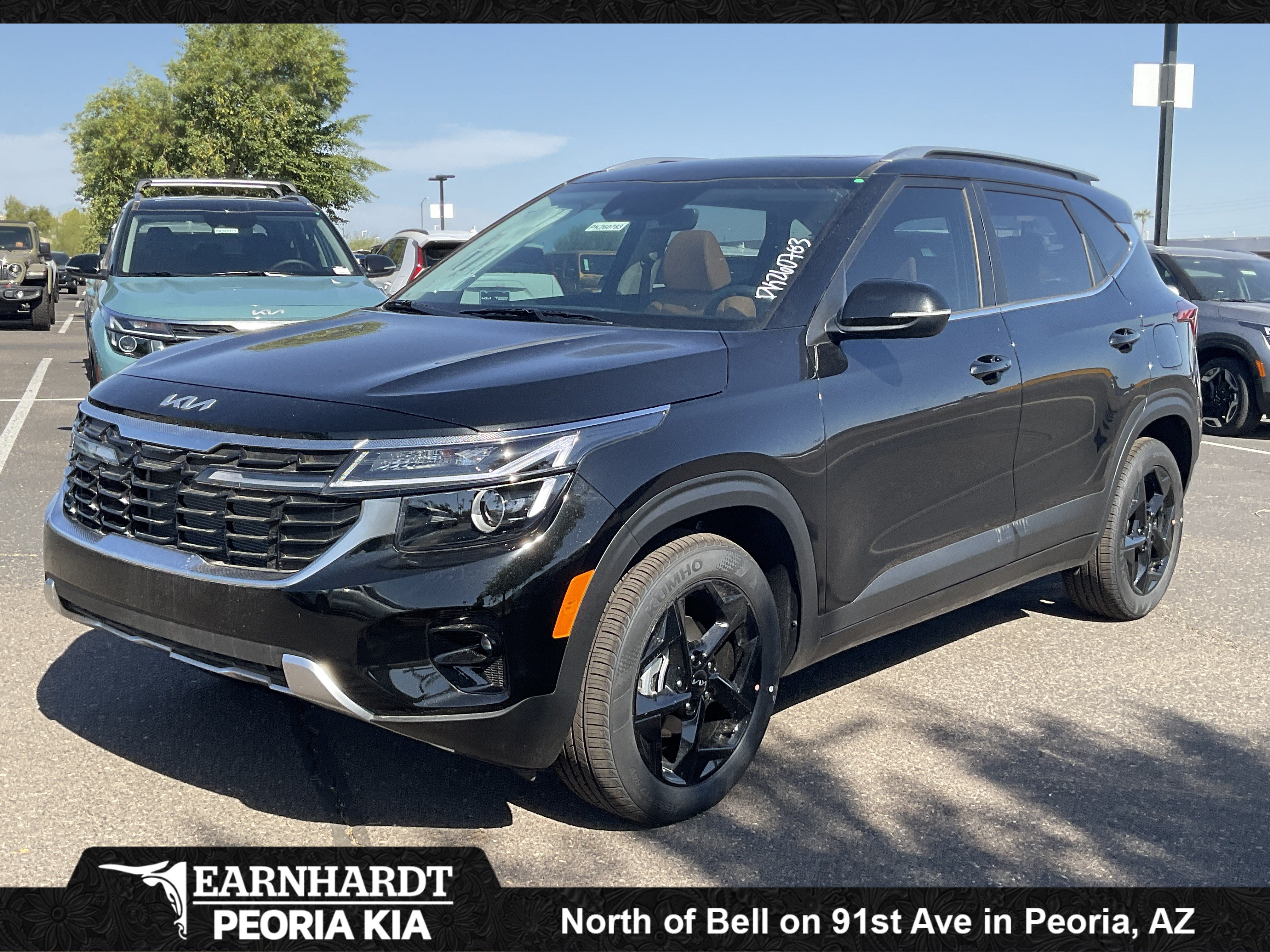 2026 Kia Seltos EX in Fusion Black — front three-quarter view