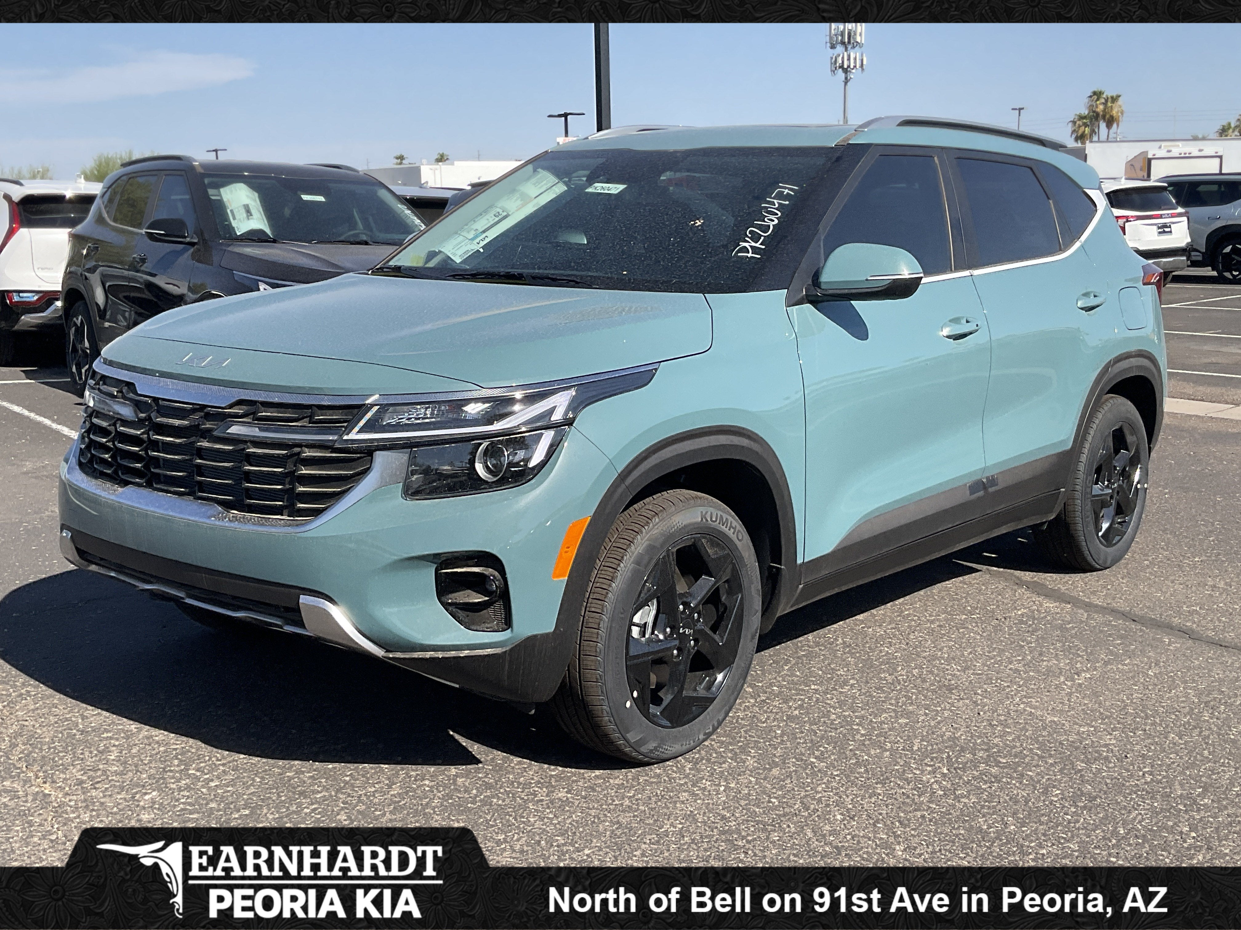 2026 Kia Seltos EX in Pluton Blue — front three-quarter view