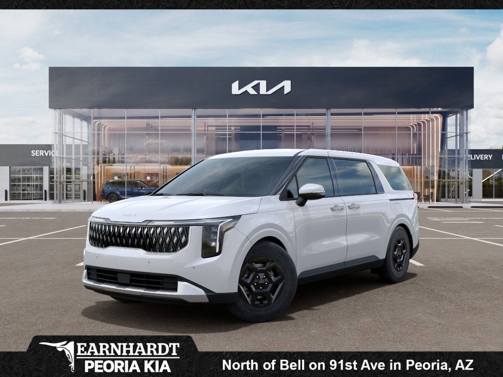 2026 Kia Carnival LXS in Snow White Pearl — front three-quarter view