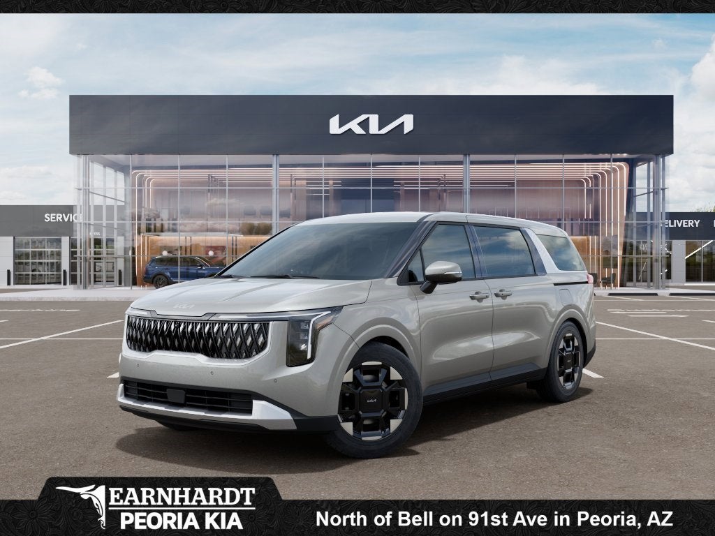 2026 Kia Carnival EX in Ivory Silver — front three-quarter view