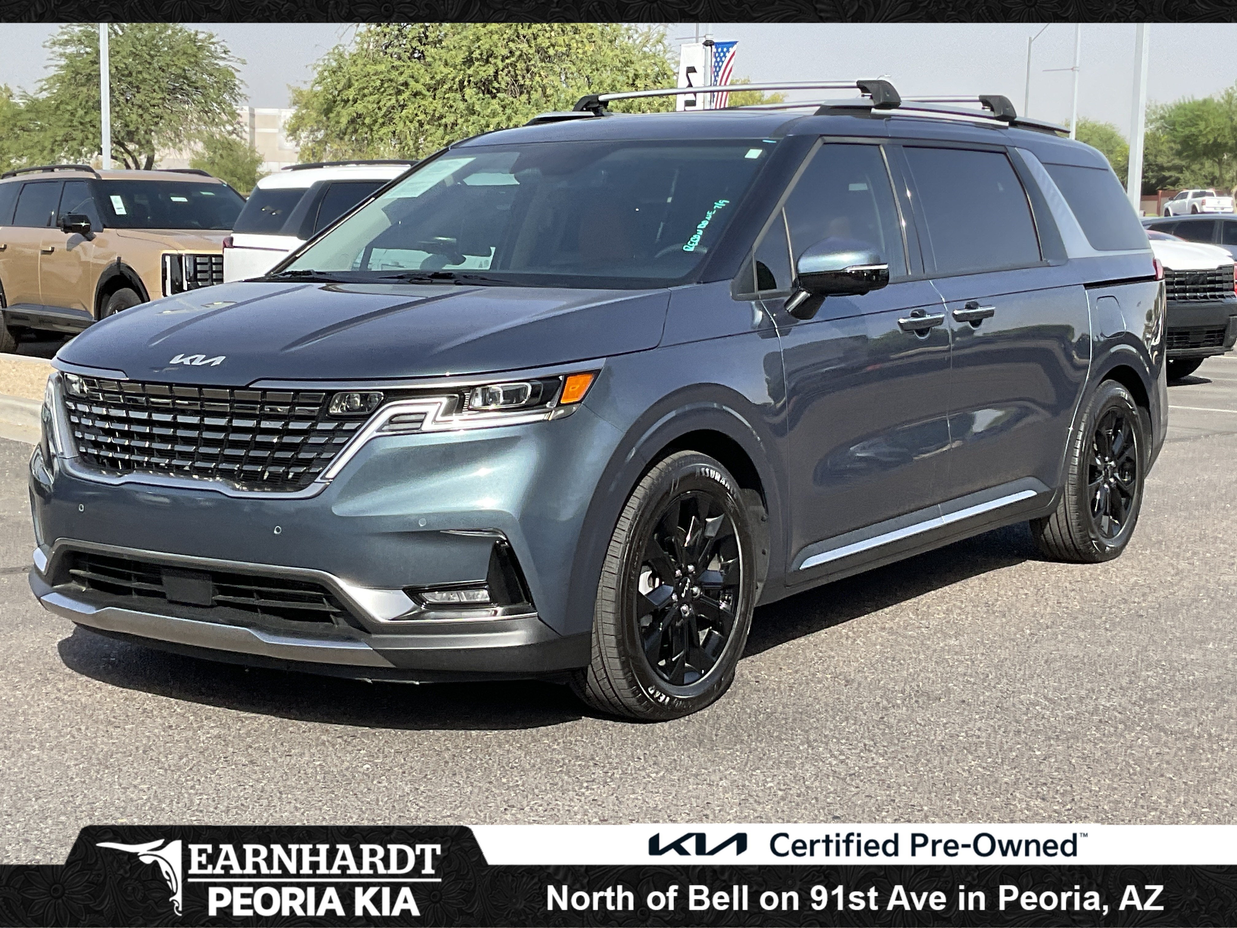 2024 Kia Carnival SX*CLEAN CARFAX in Astra Blue — front three-quarter view
